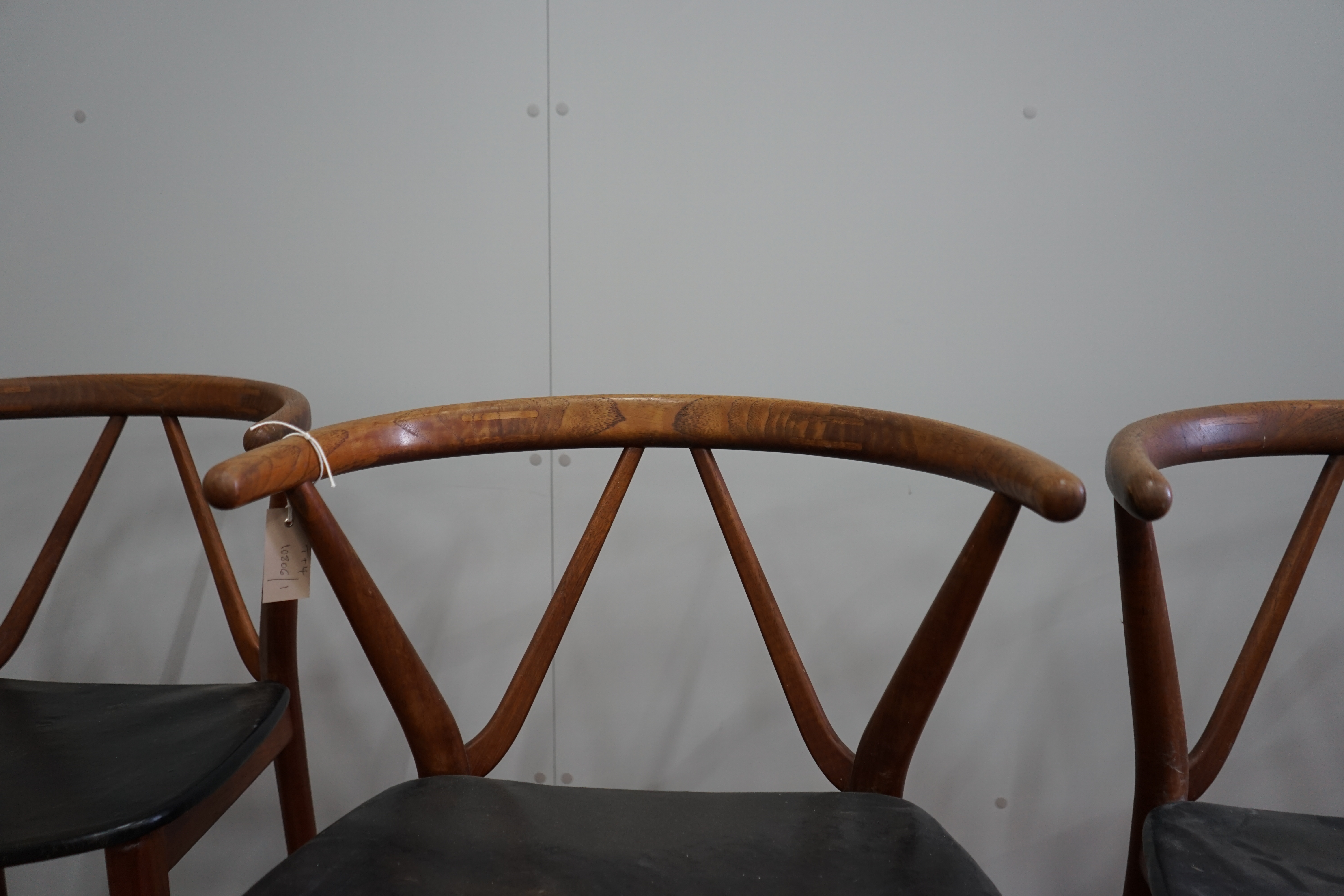 Henning Kjaernulf for Bruno Hansen, four Model 225 'Wishbone' teak dining chairs, width 55cm, depth 44cm, height 64cm and a rectangular extending teak dining table, 244cm extended, width 89cm, height 72cm